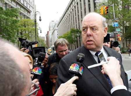 FILE PHOTO: Lawyer John Dowd (R) is met with reporters as he exits Manhattan Federal Court in New York, NY, U.S., May 11, 2011. REUTERS/Brendan McDermid/File Photo