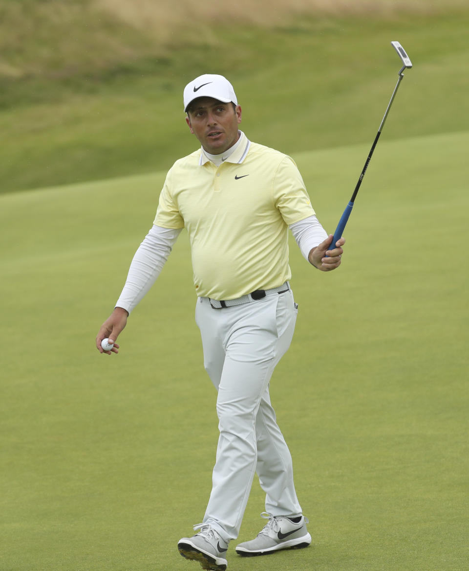 Italy's Francesco Molinari acknowledges the crowd on the 12th green after putting during the final round of the British Open Golf Championships at Royal Portrush in Northern Ireland, Sunday, July 21, 2019.(AP Photo/Peter Morrison)