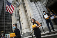 FILE - In this July 11, 2020, file photo, mourners carry out the remains of loved ones following the blessing of the ashes of Mexicans who died from COVID-19 at St. Patrick's Cathedral in New York. Government health officials say Native Americans, Latinos and Black people are two to three times more likely than whites to die of COVID-19. (AP Photo/Eduardo Munoz Alvarez, File)