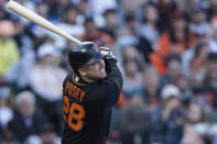 San Francisco Giants' Buster Posey hits an RBI double against the Los Angeles Dodgers in the first inning of a baseball game in San Francisco, Saturday, Sept. 4, 2021. (AP Photo/John Hefti)