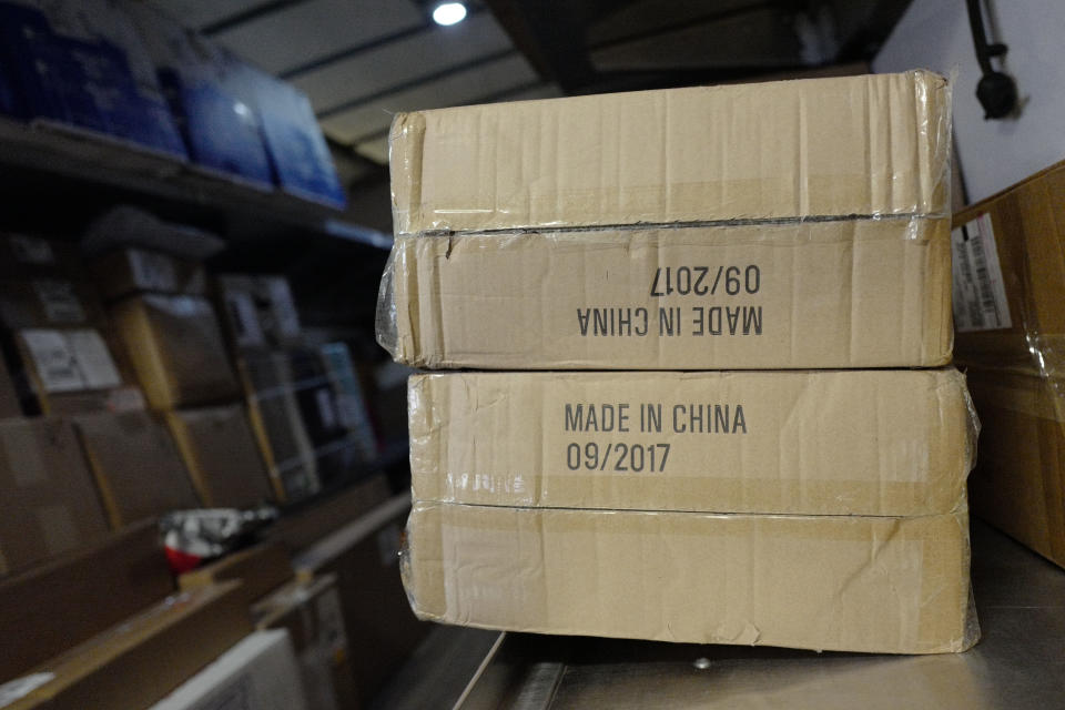 FILE- In this May 9, 2017, file photo packages labeled "Made in China" are loaded on a UPS truck for delivery in New York. Starting Monday, Sept. 17, 2018, the United States is to begin charging a 10 percent tax on thousands of Chinese imports — tires, windshield wipers, baseball gloves, bicycles, snakeskin pants, backpacks, trombone cases, refrigerators and wooden furniture, among others. The list runs 194 pages. (AP Photo/Mark Lennihan, File)