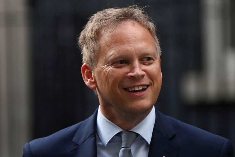 FILE PHOTO: Britain's Transport Secretary Grant Shapps walks outside Downing Street in London