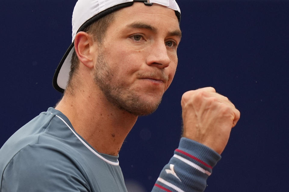 Jan-Lennard Struff of Germany celebrates winning the final match against Taylor Fritz of the United States at the Tennis ATP tournament in Munich, Germany, Sunday, April 21, 2024. (AP Photo/Matthias Schrader)