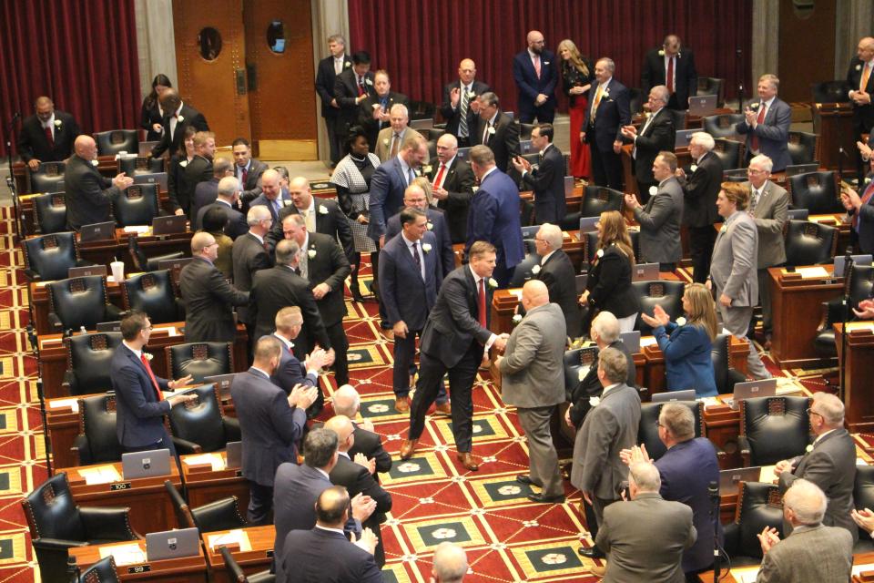 Speaker of the House Dean Plocher, a St. Louis Republican (center), greets members of the House after being elected to lead the chamber in Jefferson City on Jan. 4, 2023.