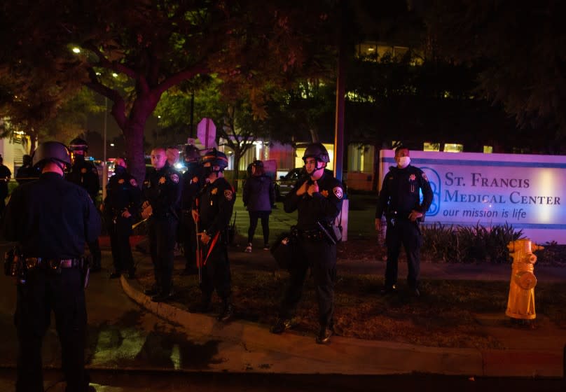 LYNWOOD, CA - SEPTEMBER 12: A large number of Sheriff's deputies stand gaurd outside St. Francis Medical Center where two L.A. County sheriff's deputies are being treated for after being shot and gravely injured in attack, after St. Francis Medical Center's security reported what they thought to be protesters on the property on Saturday, Sept. 12, 2020 in Lynwood, CA (Jason Armond / Los Angeles Times)