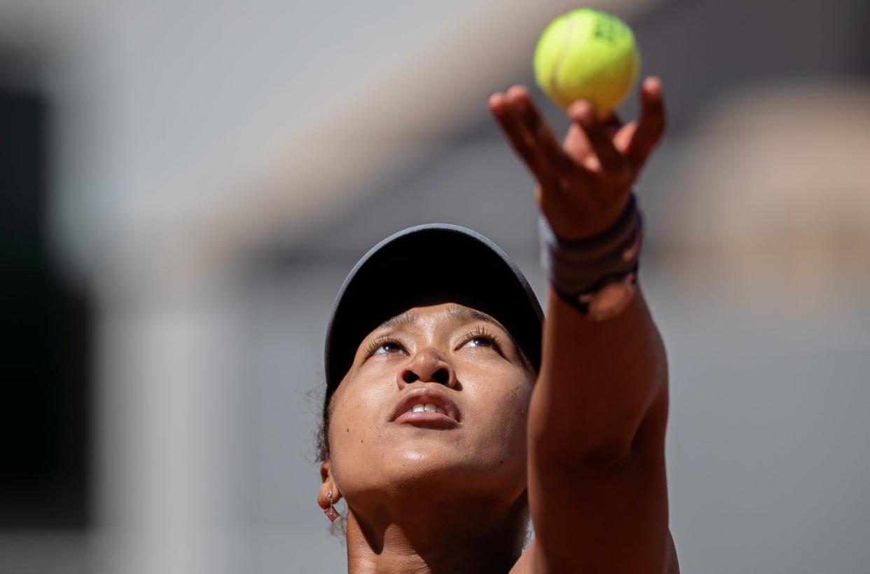 <span class="caption"><span class="caas-xray-inline-tooltip"><span class="caas-xray-inline caas-xray-entity caas-xray-pill rapid-nonanchor-lt" data-entity-id="Naomi_Osaka" data-ylk="cid:Naomi_Osaka;pos:1;elmt:wiki;sec:pill-inline-entity;elm:pill-inline-text;itc:1;cat:Athlete;" tabindex="0" aria-haspopup="dialog"><a href="https://search.yahoo.com/search?p=Naomi%20Osaka" data-i13n="cid:Naomi_Osaka;pos:1;elmt:wiki;sec:pill-inline-entity;elm:pill-inline-text;itc:1;cat:Athlete;" tabindex="-1" data-ylk="slk:Naomi Osaka;cid:Naomi_Osaka;pos:1;elmt:wiki;sec:pill-inline-entity;elm:pill-inline-text;itc:1;cat:Athlete;" class="link ">Naomi Osaka</a></span></span> keeps her eye on the ball as she prepares to serve.</span> <span class="attribution"><a class="link " href="https://www.gettyimages.com/detail/news-photo/osaka-naomi-of-japan-serves-the-ball-during-the-womens-news-photo/1233196208?adppopup=true" rel="nofollow noopener" target="_blank" data-ylk="slk:Aurelien Morissard/Xinhua via Getty Images;elm:context_link;itc:0;sec:content-canvas">Aurelien Morissard/Xinhua via Getty Images</a></span>