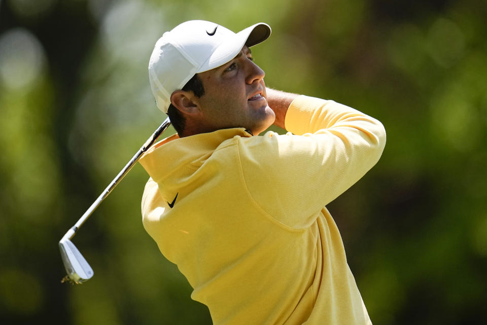 Scottie Scheffler watches his tee shot on the third hole during the first round of the PGA Championship golf tournament at Oak Hill Country Club on Thursday, May 18, 2023, in Pittsford, N.Y. (AP Photo/Abbie Parr)