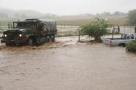 Colorado National Guardsmen respond to floods in Boulder County, Colorado, in this handout photo provided by the Army National Guard and taken on September 12, 2013. The National Guard on Friday evacuated a Colorado town cut off by raging floodwaters, while forecasters called for some let-up in record rains that have killed three people, washed out dams and swamped roads across the state. Picture taken September 12, 2013. (REUTERS/Joseph K. VonNida/Army National Guard)