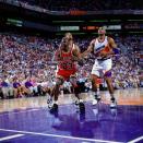Michael Jordan met Charles Barkley and the Phoenix Suns in the 1993 NBA Finals. Despite Barkley's proclamation that his Suns would win, Jordan averaged a record 41 points per game in the six-game Finals. (Getty Images)