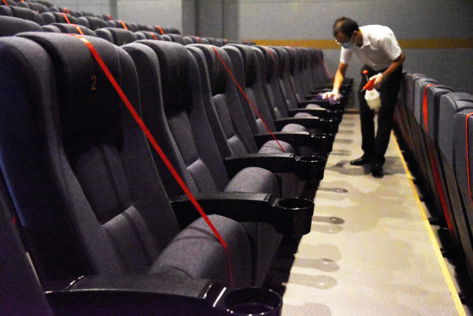 JINAN, July 20, 2020  -- An employee disinfects a movie theater which has reopened in Jinan, east China's Shandong Province, July 20, 2020.   Some movie theaters have reopened on Monday in Jinan on the premise that proper prevention and control measures have been put into place. (Photo by Wang Kai/Xinhua via Getty) (Xinhua/Wang Kai via Getty Images)