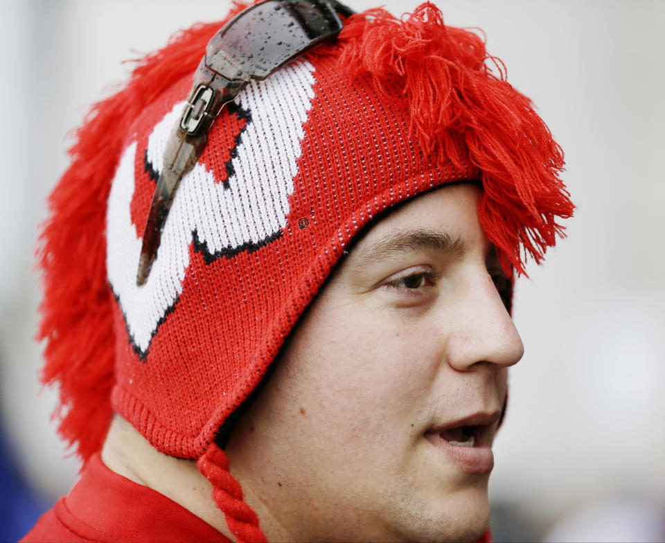 Wisconsin fan Mike Tedford of Ranco Cucamunga, Calif arrives for the NCAA Final Four tournament college basketball semifinal games Saturday, April 5, 2014, in Arlington, Texas. (AP Photo/Charlie Neibergall)