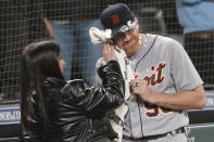 Detroit Tigers starting pitcher Spencer Turnbull (56) has shaving cream wiped from his face by an unidentified woman after he threw a no-hitter in the team's baseball game against the Seattle Mariners, Tuesday, May 18, 2021, in Seattle. The Tigers won 5-0. (AP Photo/Ted S. Warren)