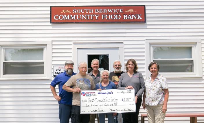 Representatives of Partners Bank and of Aroma Joe’s met at South Berwick Community Food Pantry to deliver a check to Pantry organizers on July 1. From left to right are: Brian Sillon, Cofounder of Aroma Joe’s; Dave Stansfield; Mary Stansfield; Mike Ouellette; Richard Goodenough, Commercial Lender at Partners Bank; Karyn Scharf Morin, Branch Administration; and Julia Ouelette.