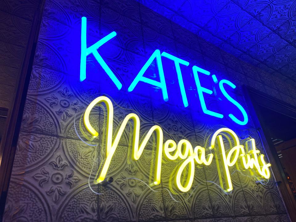 The 32-ounce "mega pints" at Klondike Kate's in Newark are so popular that they have their own neon sign at the upstairs bar.