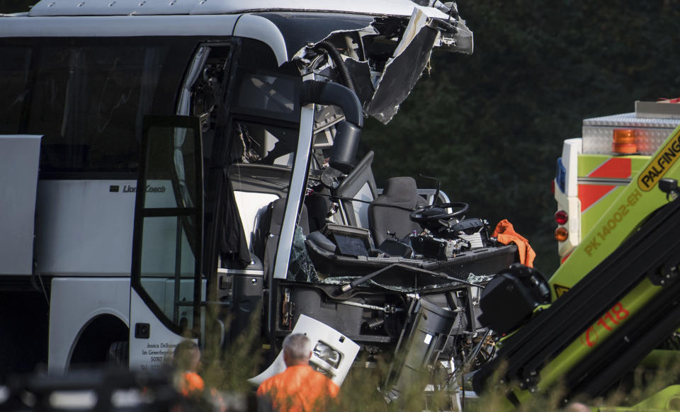 The accident site of a bus that crashed into signal post on the highway A2 in Sigirino, canton of Ticino, Switzerland, Sunday, Oct. 14, 2018. The A2 highway between Rivera and Lugano-North in is closed to the south. Several people were injured in the accident. (Gabriele Putzu, Ti-Press/Keystone via AP)