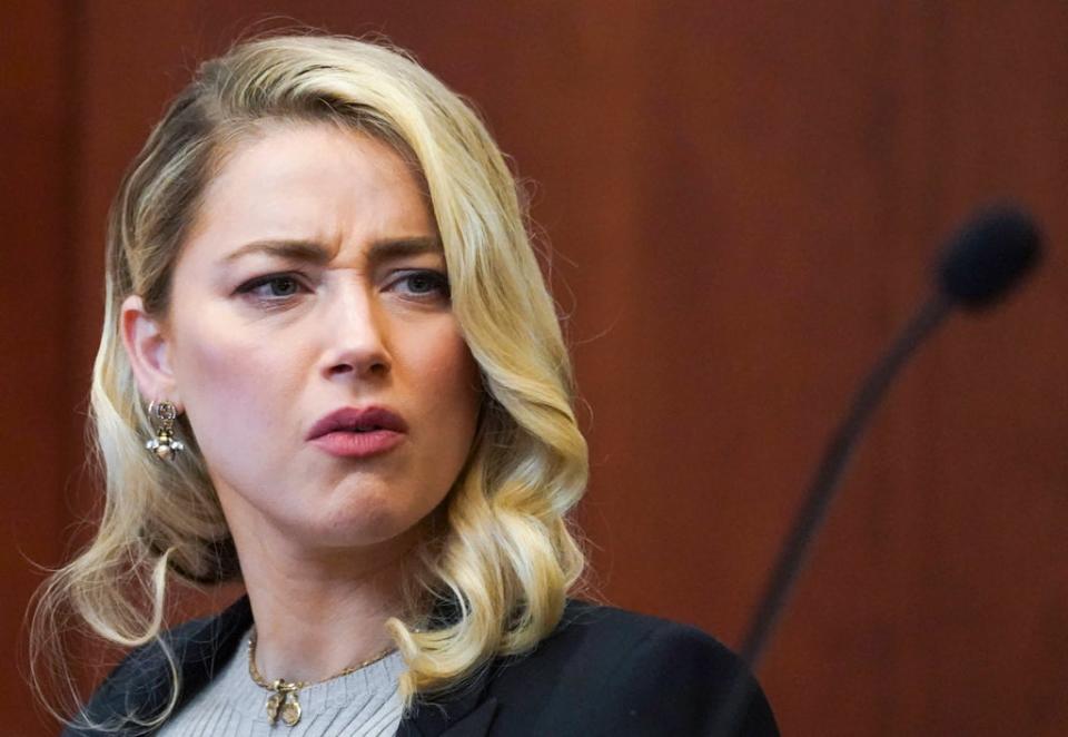 Amber Heard reacts in the courtroom at the Fairfax County Circuit Courthouse in Fairfax (AP)