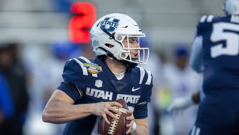 Utah State quarterback McCae Hillstead (10) looks downfield against Georgia State late in the second half of the Famous Idaho Potato Bowl NCAA college football game, Saturday, Dec. 23, 2023, in Boise, Idaho. Georgia State won 45-22. (AP Photo/Steve Conner)