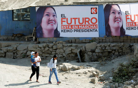 Peru's Presidential candidate Keiko Fujimori's campaign banners with her picture and reads "The future is underway: Keiko President" are seen on the walls of houses in Villa Maria del Triunfo on the outskirts of Lima, Peru, May 11, 2016. REUTERS/Mariana Bazo