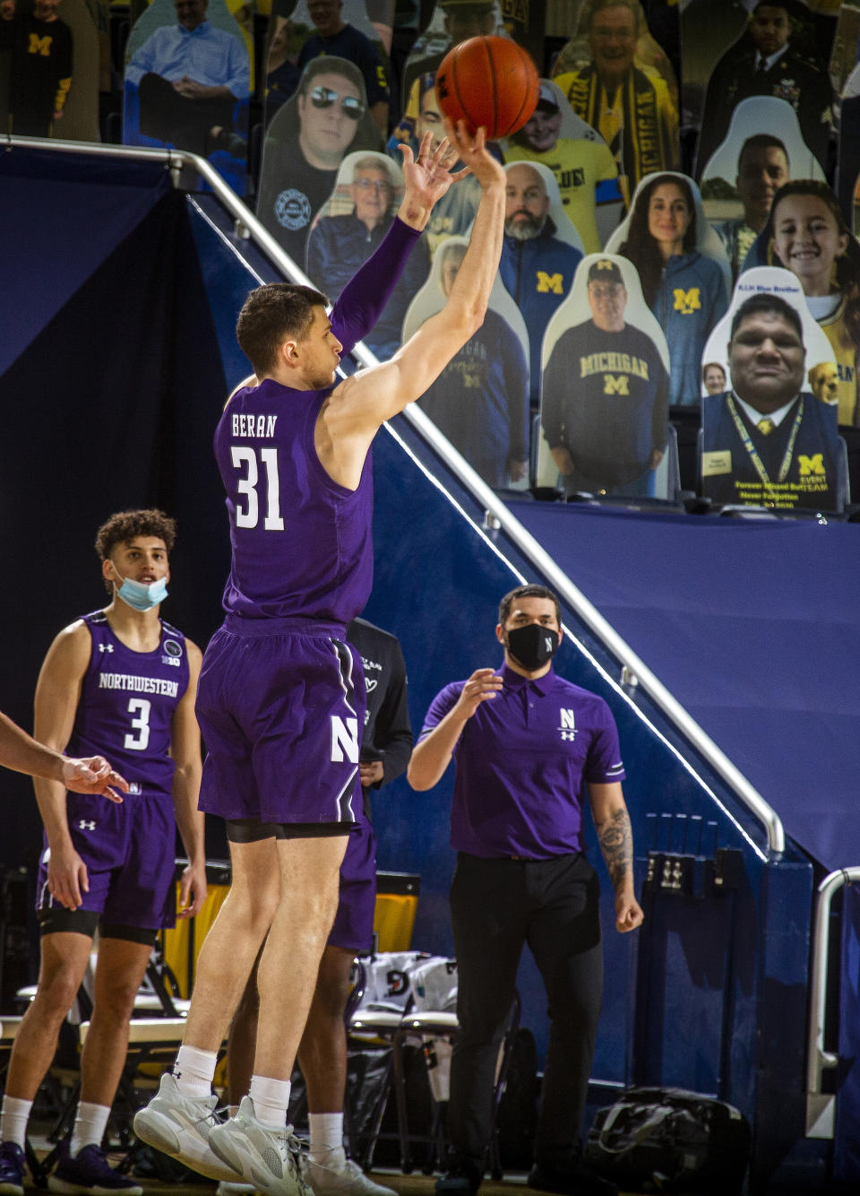 Northwestern forward Robbie Beran (31) attempts a three-point basket in the second half of an NCAA college basketball game against Michigan at Crisler Center in Ann Arbor, Mich., Sunday, Jan. 3, 2021. (AP Photo/Tony Ding)