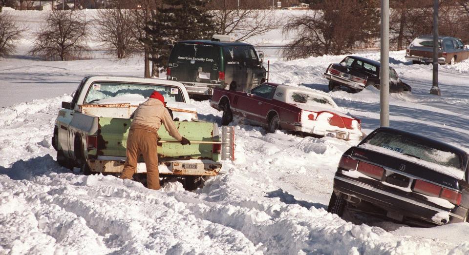 Dave Rice of Des Moines shovels Jan. 27, 1996, around his pickup, one of several vehicles abandoned on an Interstate 235 exit ramp during a blizzard that dropped 13.7 inches the previous day, the fourth-most snow recorded in Des Moines on a single day.