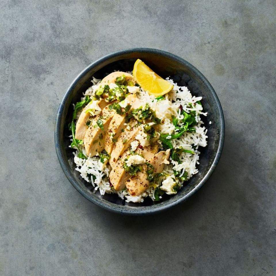 chicken and rice with feta and mint in a bowl