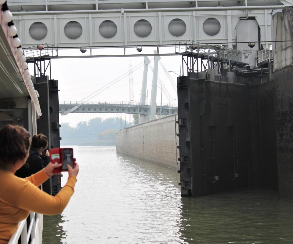 Folks snapping photos of lock closing