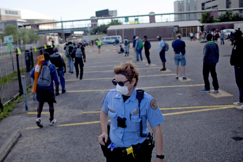 Image: Homeless people are provided with a meal as New Orleans battles coronavirus (Kathleen Flynn / Reuters)