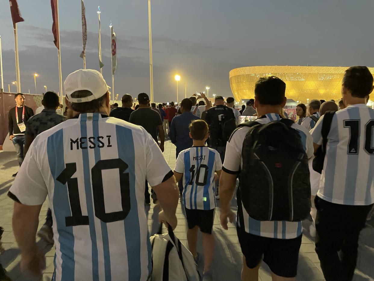 Fans from all over the world have come to Qatar to witness the brilliance of Argentina's Lionel Messi. (Henry Bushnell/Yahoo Sports)