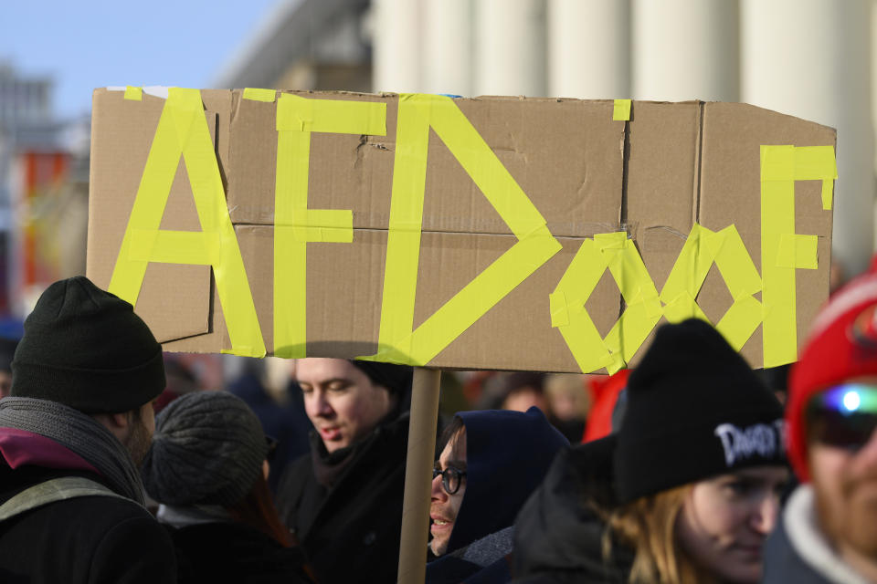 A participant carries a placard with the inscription "AFDoof" at a demonstration against the AfD and right-wing extremism in Kassel, Germany, Saturday, Jan. 20, 2024. ( Swen Pförtner/dpa via AP)