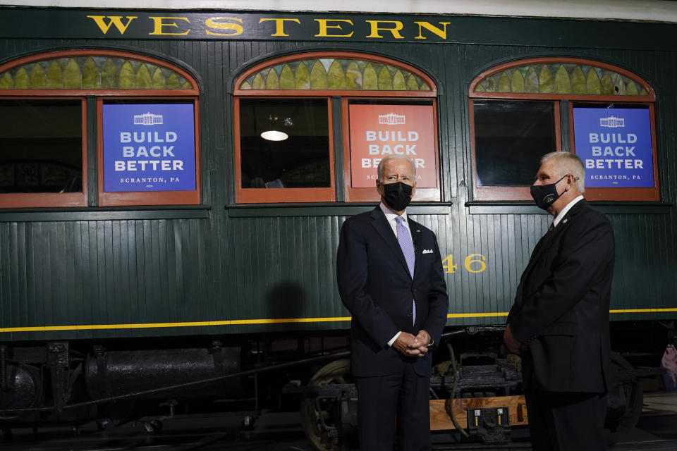 FILE - President Joe Biden tours the Electric City Trolley Museum with Wayne R. Hiller, executive director and manager of the museum during a visit to his hometown of Scranton, Pa., Oct. 20, 2021. Pennsylvania has been a core part of Biden's political identity for years. It's where he grew up, and he was jokingly called the state's “third senator” even though he represented neighboring Delaware. Now he's returning to Pennsylvania repeatedly to help Democratic candidates even though he's largely absent from the campaign trail in other key battlegrounds like Georgia, Nevada and Ohio. (AP Photo/Susan Walsh, File)