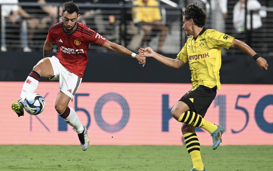 Manchester United captain Bruno Fernandes takes on Dortmund&#39;s Guille Bueno in Las Vegas - Andre Onana confronts Harry Maguire as Erik ten Hag slams Man Utd for Borussia Dortmund capitulation