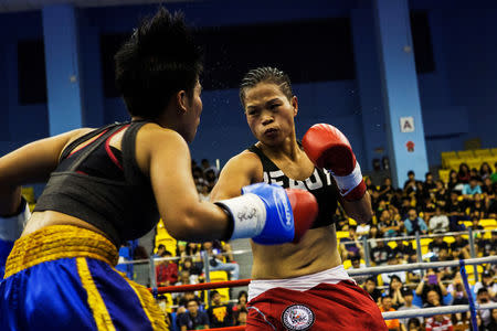 Huang Wensi fights against Thailand's Jarusiri Rongmuang for the Asia Female Continental Super Flyweight Championship gold belt in Taipei, Taiwan, September 26, 2018. REUTERS/Yue Wu