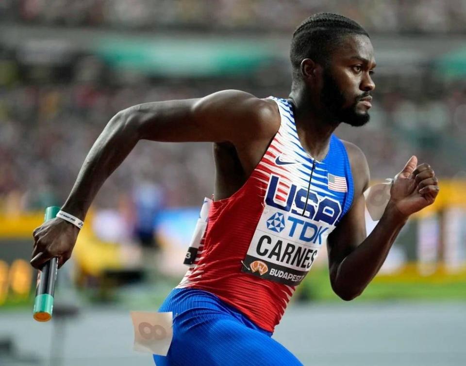 Former Manatee High standout Brandon Carnes runs his leg of the USA 4x100 relay team Saturday at the World Athletics Championships in Budapest, Hungary. The USA won the gold medal.