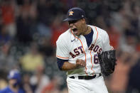 Houston Astros starting pitcher Bryan Abreu reacts after striking out Texas Rangers' Nick Solak during the 10th inning of a baseball game Thursday, May 13, 2021, in Houston. (AP Photo/David J. Phillip)