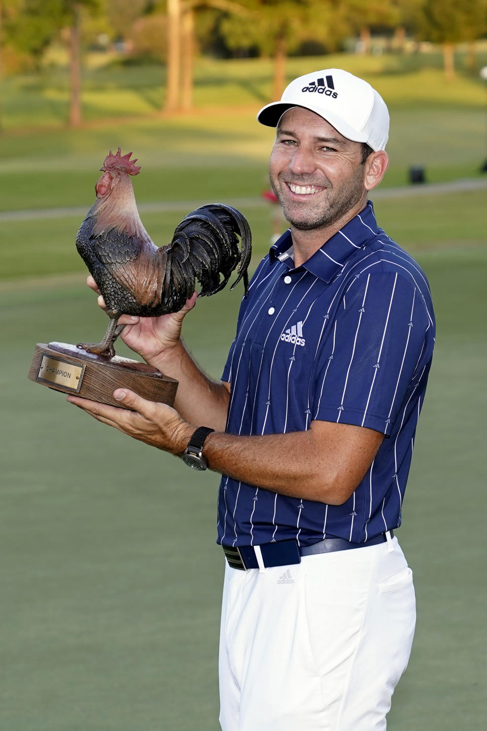 Sergio Garcia, of Spain, holds the Sanderson Farms Championship trophy after winning the PGA golf tournament in Jackson, Miss., Sunday, Oct. 4, 2020. (AP Photo/Rogelio V. Solis)