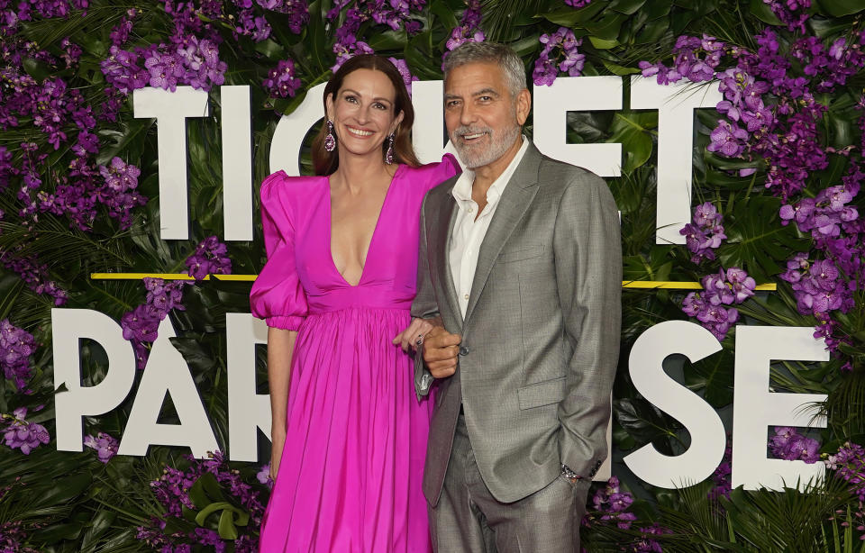 Julia Roberts, left, and George Clooney, the co-stars of "Ticket to Paradise," pose together at the premiere of the film, Monday, Oct. 17, 2022, at the Regency Village Theatre in Los Angeles. (AP Photo/Chris Pizzello)