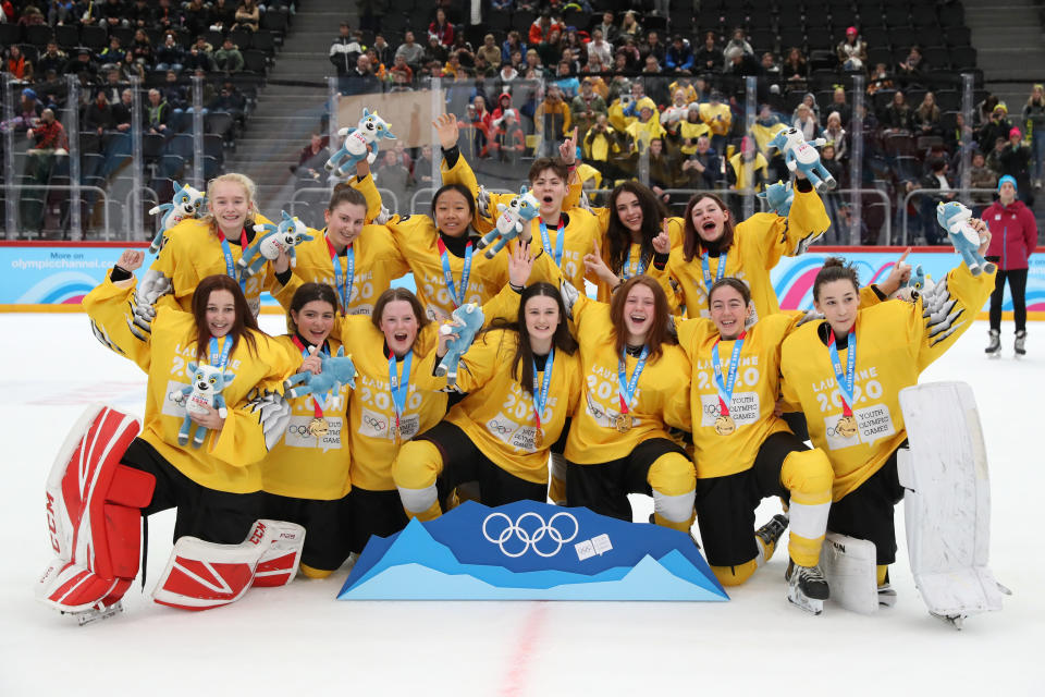 LES DIABLERETS, SWITZERLAND - JANUARY 15: Players of Team Yellow celebrate following their victory in their Women's Mixed Ice Hockey NOC 3-on-3 Finals Gold Medal match against Team Black during day 6 of the Lausanne 2020 Winter Youth Olympics at Vaudoise Arena on January 15, 2020 in Lausanne, Switzerland. (Photo by Linnea Rheborg/Getty Images)