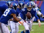 <p>New York Giants quarterback Eli Manning (10) pitches the ball to running back Rashad Jennings (23) in the first half against the Detroit Lions at MetLife Stadium. Mandatory Credit: Robert Deutsch-USA TODAY Sports </p>