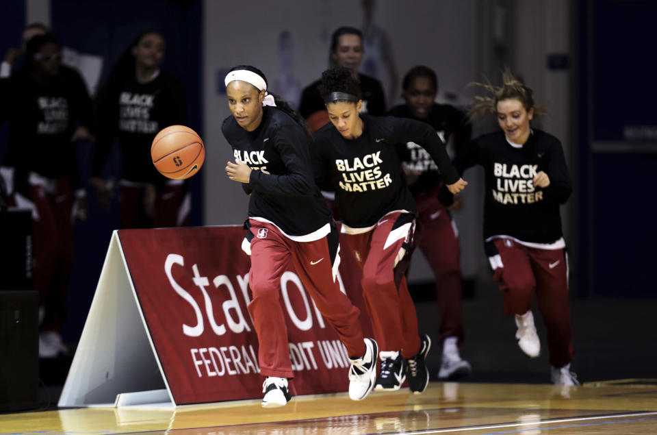 The Stanford women's NCAA college basketball team enter the court prior to their game against Oregon in Santa Cruz, Calif., Friday, Jan. 8, 2021. (AP Photo/Jed Jacobsohn)