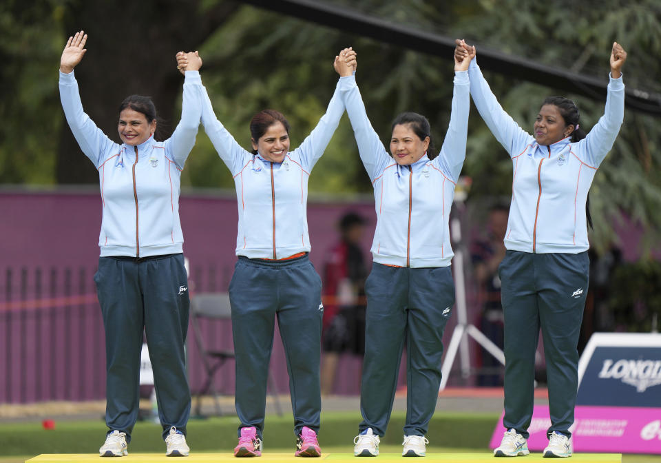 India's Lovely Choubey, Pinki Kaushik Singh, Nayanmoni Saikia and Rupa Rani Tirkey celebrate victory in the Women's Fours Lawn Bowls final, at Victoria Park on day five of the 2022 Commonwealth Games in Birmingham, England, Tuesday Aug. 2, 2022. (Tim Goode/PA via AP)