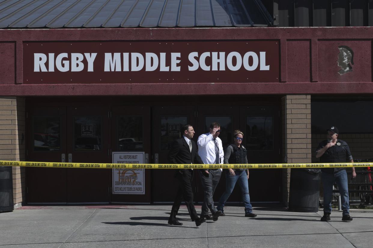 Investigators leave Rigby Middle School after a shooting at the Rigby, Idaho, school on Thursday.