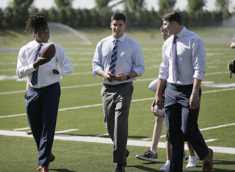 Shaquem Griffin (left), takes part in an NFL draft event in Frisco, Texas, with Mason Rudolph (middle) and Josh Allen. (AP) 