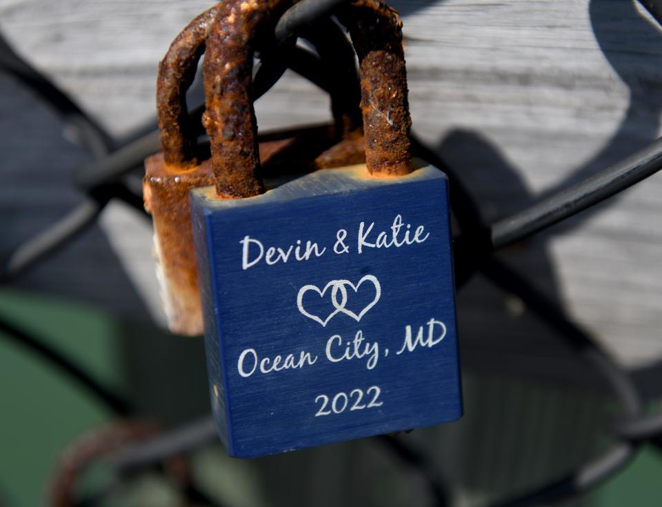 Locks still attached to the fishing pier fencing Monday, June 17, 2024, in Ocean City, Maryland.