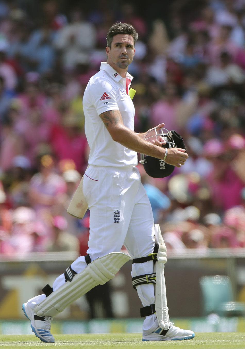 FILE - England's Kevin Pietersen walks off the field after his wicket fell on the third day of their Ashes cricket Test match in Sydney, Australia, in this file photo dated Sunday, Jan. 5, 2014. Pietersen's England career appears to be over, it is announced Tuesday Feb. 4, 2013, after the brash batsman was not selected for the upcoming tour of West Indies. Pietersen has attracted controversy during his playing career and accused of being a divisive influence within the England team, but he went on to play 104 Test matches, 136 one-day games and 37 Twenty20 fixtures for England. (AP Photo/Rob Griffith)