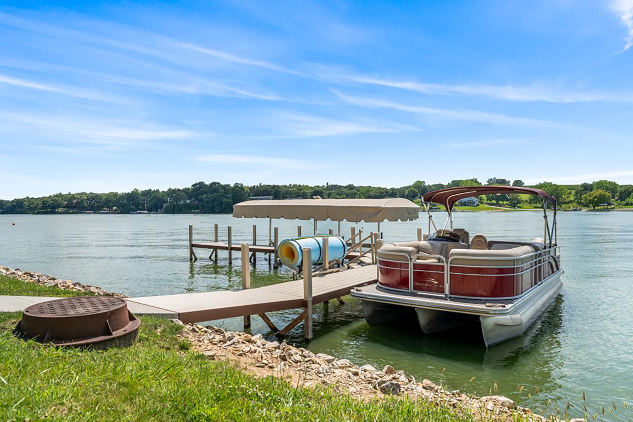 This striking home on Diamondhead Lake in Dexter is on the market for $1.1 million. See inside. Here, the boat, which comes with the house, and the dock on the lake.