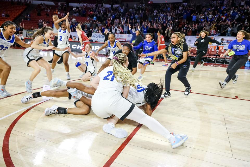 Sapulpa celebrates after a 75-74 win against Tulsa Holland Hall in the Class 5A girls basketball state championship game Saturday at Lloyd Noble Center in Norman.