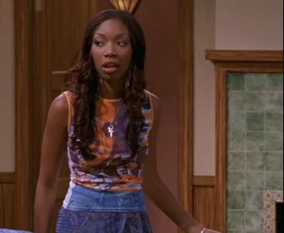 Moesha wearing a graphic tank with a skirt