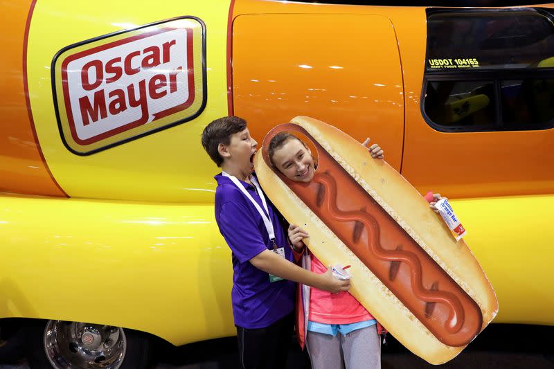 FILE PHOTO: DJ O'Keefe and his sister Dallas pose for a photo with the Oscar Mayer Weiner Mobile at the annual Berkshire Hathaway shareholder meeting in Omaha