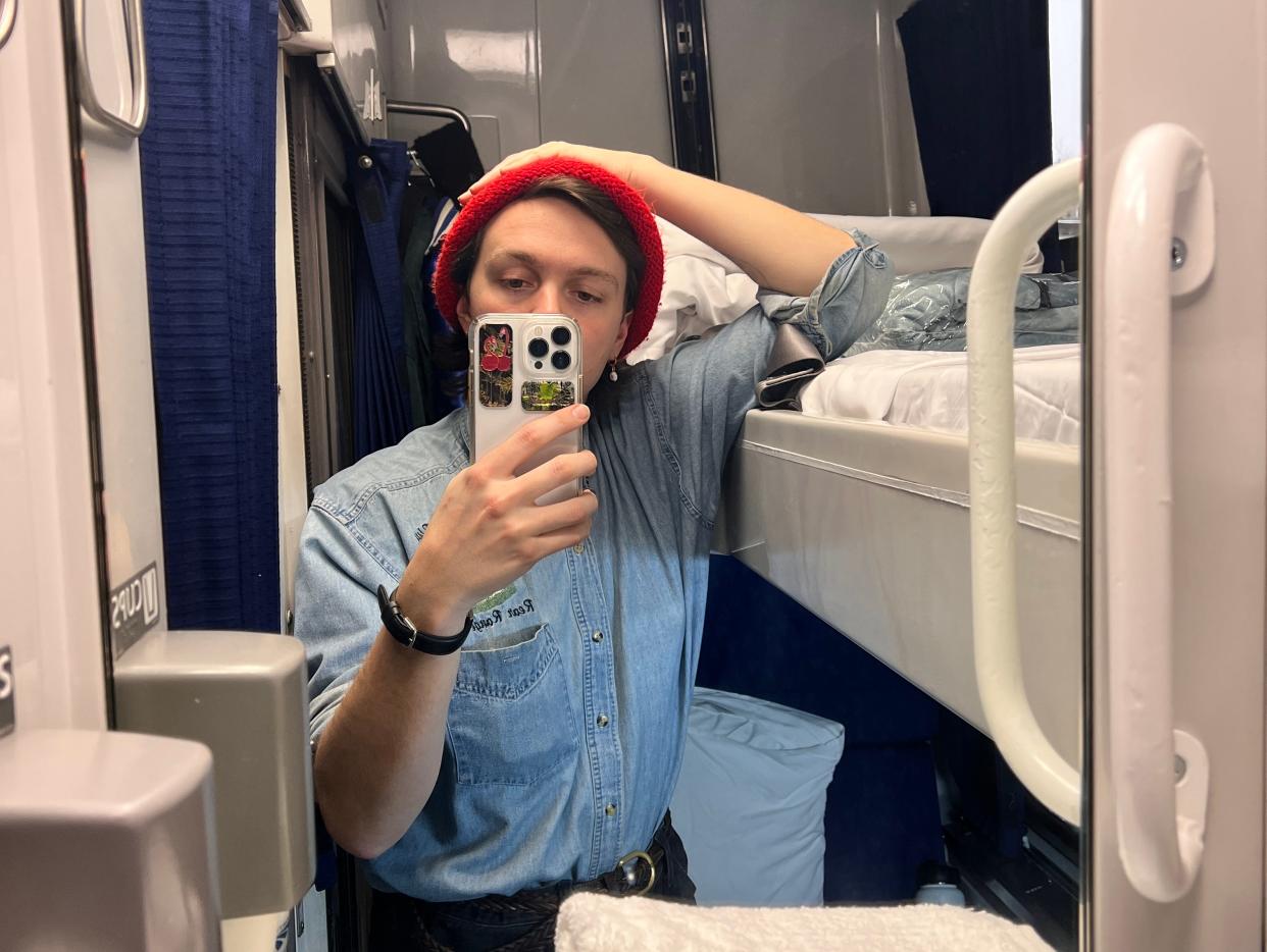 JB taking a mirror selfie in an amtrak roomette