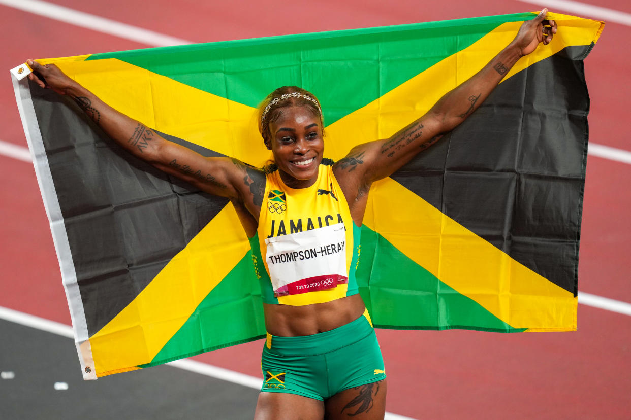 TOKYO, JAPAN - JULY 31: Elaine Thompson-Herah of Team Jamaica poses after winning the gold medal while competing on Women's 100m Final during the Tokyo 2020 Olympic Games at the Olympic Stadium on July 31, 2021 in Tokyo, Japan. (Photo by Yannick Verhoeven/BSR Agency/Getty Images)